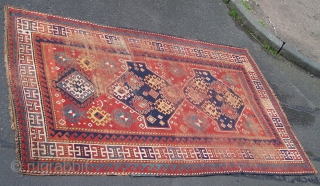 Kazak rug, Caucasian- beautiful old triple medallion rug with red field and guards giving a classic 'floating effect' with the delicate balance between motifs and red ground; this effect is compounded by  ...