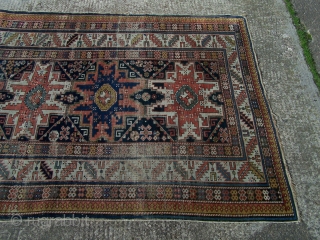 Shirvan rug, with column of four 'Lesghi' stars enclosed by ivory leaf-and-calyx border, cotton wefts, wool warps, very occasional synthetic orange (2 locations only approx -see detail image) in border, colours appear  ...