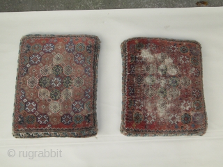 Pair of Qashqa'i cushions, converted from saddle bag, nice old items with concentric flowerhead diamond forms enclosed by interlocking borders, 19th.century, 35 x 45cm each        