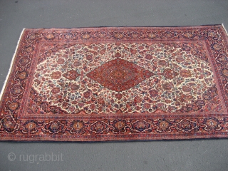 Kashan rug, 4' 3" X 7' 2", probably circa 1920-1930.  Scarce ivory ground.  Even low to slightly better pile all over.  My restorer added new edge wrapping and other  ...