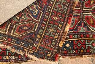 Turkish Yastik. Nice colors and drawing. Black is corroded. Soft wool and handle. No repairs. Mostly good pile, with some low areas and loss to ends. The single row of purple knots  ...