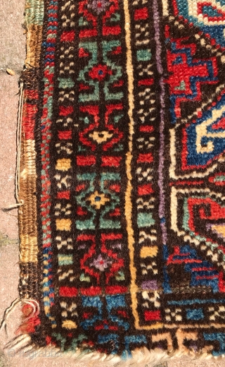 Turkish Yastik. Nice colors and drawing. Black is corroded. Soft wool and handle. No repairs. Mostly good pile, with some low areas and loss to ends. The single row of purple knots  ...