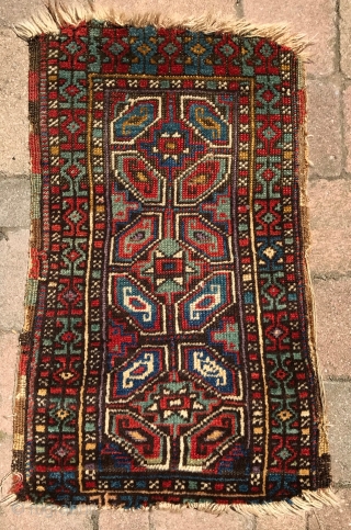Turkish Yastik. Nice colors and drawing. Black is corroded. Soft wool and handle. No repairs. Mostly good pile, with some low areas and loss to ends. The single row of purple knots  ...