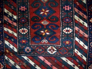 Southern Caucasian (Gendje/Kazak) rug.  34" x 74".  Borders have thick pile, parts of main field has low even pile.  Areas of repiling that were poorly done with regard to  ...