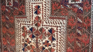 Antique Baluch prayer rug. Glossy camel field with saturated madder red in high relief, deep indigo highlights, and heavily oxidized browns, combining to form a rug of striking, sculpted presence.  Displays  ...