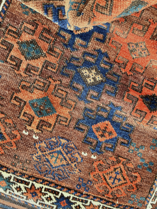 Antique Baluch. Saturated color in a wide palette on a ground of burnt-umber, largely undyed wool. In high pile with the exception of some slightly corroded browns. The gloss of ...
