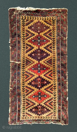 Antique camel field balisht with richly saturated aubergine, madder and emerald green which in places has oxidized. Wear at the margins and a split have not marred the impact of the wool  ...