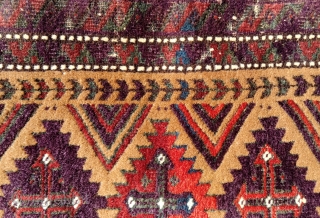 Antique camel field balisht with richly saturated aubergine, madder and emerald green which in places has oxidized. Wear at the margins and a split have not marred the impact of the wool  ...