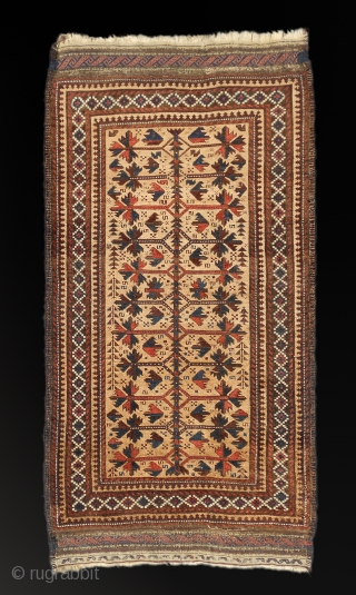 Antique Baluch rug.  3" (96cm) x 5' (150cm).  In excellent pile, good colors, glowing camel field, glossy wool, minor corrosion. Striking graphic.         