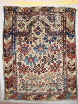 Shirvan 15 Snowflake Stars on Ivory. A 19th century prayer rug of petite dimensions. Camel hair and wool, some cotton weft. Numerous small holes and nicks, no restorations. A battle-scarred veteran of  ...