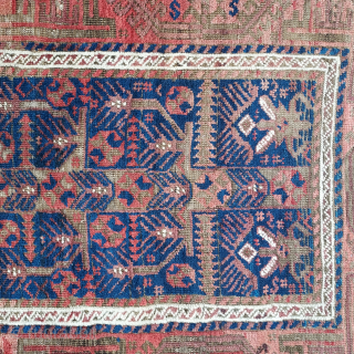 Antique Baluch rug with Rare Tree and stylized garden design on Deep Indigo ground, 34 x 64 inches. Lush pile with uneven wear and corroded browns; rough passages at sides stabilized by  ...
