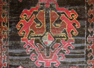 "Mystery" Caucasian long rug, 41 x 96 inches / 104 x 244 cm. Five differently conceived hooked diamond medallions on a black field. I suspect it may have originated from the NorthEast  ...