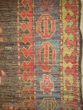 "Mystery" Caucasian long rug, 41 x 96 inches / 104 x 244 cm. Five differently conceived hooked diamond medallions on a black field. I suspect it may have originated from the NorthEast  ...