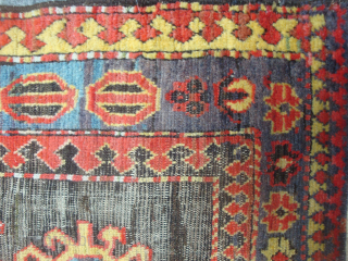 "Mystery" Caucasian long rug, 41 x 96 inches / 104 x 244 cm. Five differently conceived hooked diamond medallions on a black field. I suspect it may have originated from the NorthEast  ...