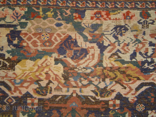 Inventively eventful early 20th century Kuba Seikhur so-called "Sport" carpet fragment, lower end rewoven including warp end braids, 48 x 68 inches. Loose and floppy handle, silky wool in fairly good pile  ...