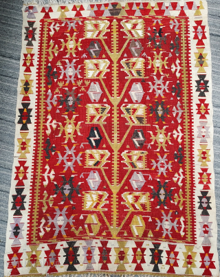 Mid-20th century Anatolian small Tree kilim, 3'2" x 4'6". Robust yellow gold Tree with 5 pairs of geometrically stylized leaves, each containing 5 smaller leaf forms, on a deep crimson field. Broad  ...