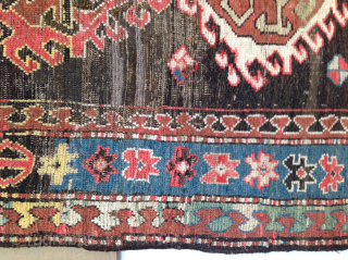 Dramatic and exceptional Caucasus long rug, 5 diversely drawn Hooked Diamonds on Dark Brown-Black Field, 104 x 244 cm  (3'5" x 8'). Coarse, irregular weave, deep saturated reds, greens, blues, yellows  ...