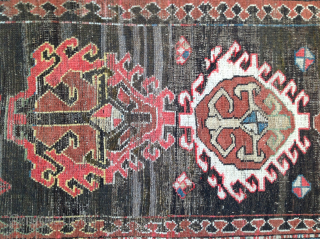 Dramatic and exceptional Caucasus long rug, 5 diversely drawn Hooked Diamonds on Dark Brown-Black Field, 104 x 244 cm  (3'5" x 8'). Coarse, irregular weave, deep saturated reds, greens, blues, yellows  ...