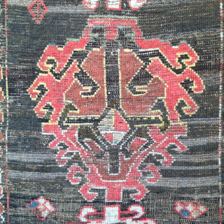 Dramatic and exceptional Caucasus long rug, 5 diversely drawn Hooked Diamonds on Dark Brown-Black Field, 104 x 244 cm  (3'5" x 8'). Coarse, irregular weave, deep saturated reds, greens, blues, yellows  ...