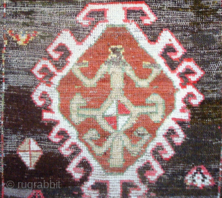 Dramatic and exceptional Caucasus long rug, 5 diversely drawn Hooked Diamonds on Dark Brown-Black Field, 104 x 244 cm  (3'5" x 8'). Coarse, irregular weave, deep saturated reds, greens, blues, yellows  ...