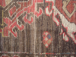 Dramatic and exceptional Caucasus long rug, 5 diversely drawn Hooked Diamonds on Dark Brown-Black Field, 104 x 244 cm  (3'5" x 8'). Coarse, irregular weave, deep saturated reds, greens, blues, yellows  ...