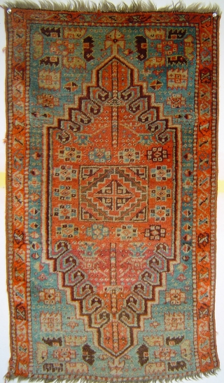 Sparkling little Anatolian yastik with rare gul and a mini=prayer design. Both madder and cochineal reds. Luminous silky angora-like wool. One end reduced, and so is the price.     