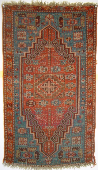 Sparkling little Anatolian yastik with rare gul and a mini=prayer design. Both madder and cochineal reds. Luminous silky angora-like wool. One end reduced, and so is the price.     