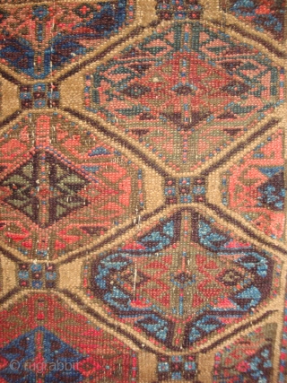 Baluch Gul Lattice Rug, symmetrical knots, possibly Bahluli, 33 x 61 inches.  Late 19th century.  These photos cannot convey the variety of vivid colors including a deep Aubergine (the lattice,  ...