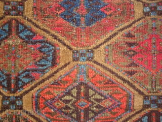 Baluch Gul Lattice Rug, symmetrical knots, possibly Bahluli, 33 x 61 inches.  Late 19th century.  These photos cannot convey the variety of vivid colors including a deep Aubergine (the lattice,  ...