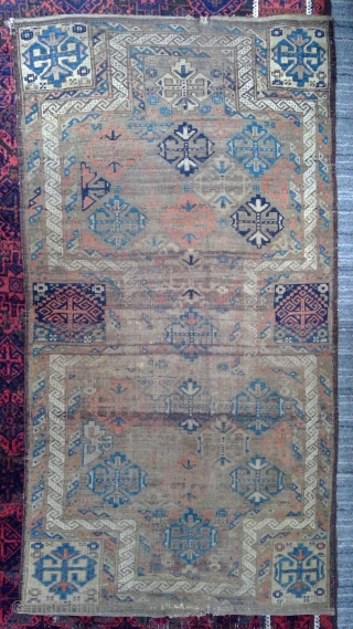Antique Symmetrically knotted Baluch Double-ended prayer rug with rare design. 34.5 x 62 inches.
Mostly even low pile with heavily corroded brown areas. Original sides and kilim ends      