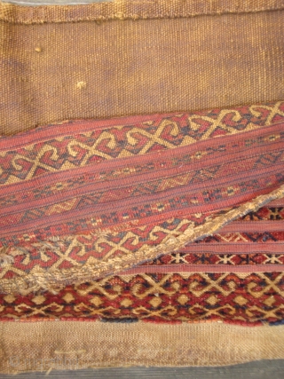 Antique 19th century mixed technique Tekke torba with 13 horizontal bands, asymmetrically knotted, on red plain weave kilim, complete with yellow kilim back and patterned strap. 37 x 14 inches. In good  ...