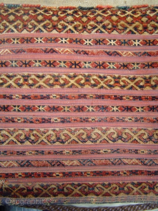 Antique 19th century mixed technique Tekke torba with 13 horizontal bands, asymmetrically knotted, on red plain weave kilim, complete with yellow kilim back and patterned strap. 37 x 14 inches. In good  ...