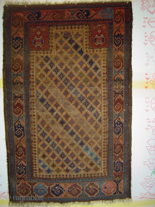Singular Baluch prayer rug, with 159 snowflake stars in a staggered repeat on the camel field. 34 x 54 inches. Each star contains a small "cross le-boutonnee". Dramatic use of a sizzling  ...