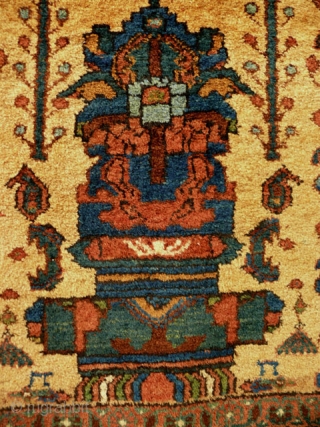 Early 20th century Afshar rug, 1.75 x 1.45m. Unusual in the absence of corner elements; very beautiful tree-of-life motif with birds and hanging flowers. Good pile; natural dyes, with golden yellow field.  ...