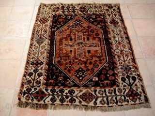 Small South Persian rug, probably Khamseh, with many intriguing features, including camels and a very attractive border. End losses and some ground showing, but overall in good condition. 1.40 x 1.08 m. 