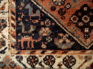 Small South Persian rug, probably Khamseh, with many intriguing features, including camels and a very attractive border. End losses and some ground showing, but overall in good condition. 1.40 x 1.08 m. 