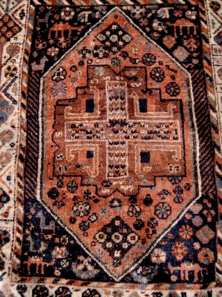 Small South Persian rug, probably Khamseh, with many intriguing features, including camels and a very attractive border. End losses and some ground showing, but overall in good condition. 1.40 x 1.08 m. 