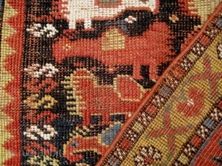 Long Khamseh 'chicken' rug; some condition issues, but dramatic and striking. Priced accordingly.                    