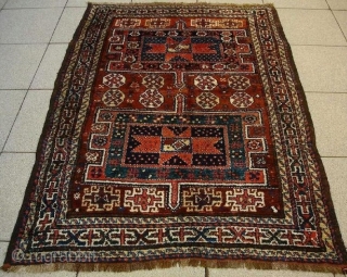 Kordi rug with two 'hawzi' mnotifs and lots of small stars. Excellent condition and natural colours, c. 1900.               