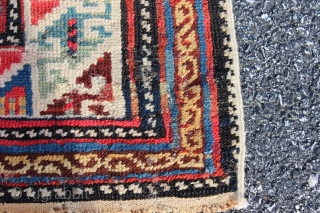 Caucasian Shirvan long rug with Memling Gul design dated 1319 or 1901.  Measures 4'3'' x 8'0''.  Vibrant colors with some early synthetics.  Good pile with some restoration and replaced  ...