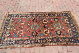 Mid 19th century or earlier Hamadan area village rug.  3'5'' x 6'9''.  Silky wool.  Original condition. Wool warp and weft. Interesting village interpretation of workshop carpets made around the  ...