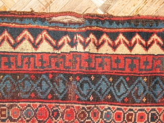 Antique Caucasian circa 1890 in fair to poor condition.  There are some old repairs on the selvage and one hole. The red dye has released in some of the cream wool.  ...