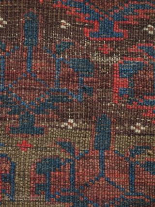 Symmetrically knotted Baluch rug, of the type now often called Bahluli. Very good color on a brown ground with Dokhtar-i Gazi shrubs and a border often seen in some Turkmen rugs.
(3'9" x  ...