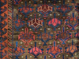 Symmetrically knotted Baluch rug, of the type now often called Bahluli. Very good color on a brown ground with Dokhtar-i Gazi shrubs and a border often seen in some Turkmen rugs.
(3'9" x  ...