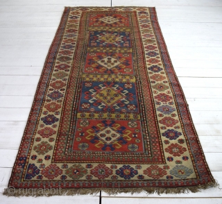 An antique south Caucasian rug of quite large proportions - 284 x 130cm.    Good vegetable dyes.    Very dirty.    Damaged and worn in places  ...