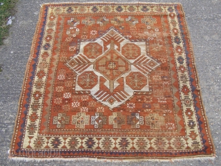 A Kazak rug of unusual design, dominated by a single stellar motif.

Square format 148 x 136cm.

Quite heavy wear.               