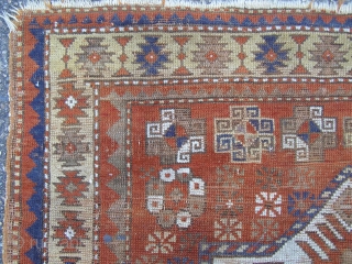 A Kazak rug of unusual design, dominated by a single stellar motif.

Square format 148 x 136cm.

Quite heavy wear.               
