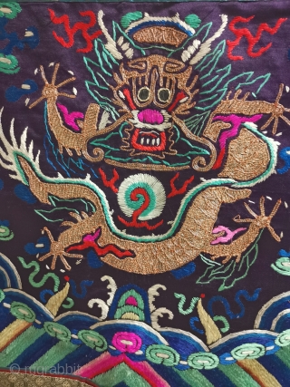 In the embroidery of the colorful Dragon Robe of the Qing Dynasty, a front five clawed dragon is embroidered with gold thread in the middle. Below it is Jiangya sea water. There  ...