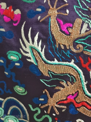 In the embroidery of the colorful Dragon Robe of the Qing Dynasty, a front five clawed dragon is embroidered with gold thread in the middle. Below it is Jiangya sea water. There  ...