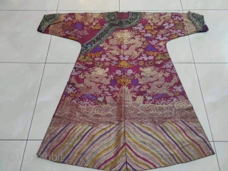 The red and multicolored brocade Dragon Robe of the Qing Dynasty.

It's clean, beautiful and undamaged.                  